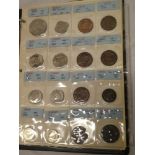 A folder of mixed GB coins including some silver examples - Victorian 1892 florin, 1898 shilling,