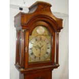 An 18th Century longcase clock by Thomas Smith of Norwich with 12" brass and silvered arched dial,