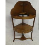 A 19th Century mahogany corner wash stand with inset bowl recess,