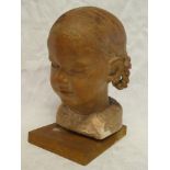 A good quality terracotta sculpture of a young girls head on wooden plinth,