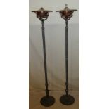 A pair of modern painted metal and copper uplighting oil lamp standards with fluted columns and