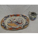 A 19th Century ironstone pottery oval meat platter with painted floral decoration and an ironstone
