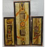 Three 1970s ceramic rectangular panels depicting flowers and geometric shapes,