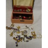 A jewellery box containing various jewellery including 9ct gold dress ring set garnets,