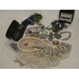 A quantity of various costume jewellery including necklaces, brooches, earrings,