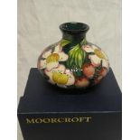 A 2005 Moorcroft pottery "Accolade" pattern squat-shaped tapered vase, three star design No.