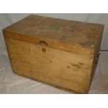 A large pine rectangular travelling trunk with iron ring handles and brass name plate named to J H