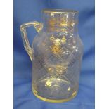 A good quality 19th Century cut glass and gilt decorated cylindrical jug with angular handle,