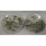 A pair of Cantonese pottery circular chargers with painted landscape and figure decoration,