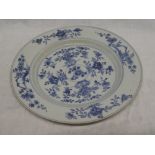 An 18th Century Chinese circular plate with blue and white floral decoration,