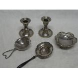 A pair of silver squat-shaped candlesticks,