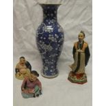 A 19th Century Chinese baluster-shaped vase with blue and white blossom decoration (af);