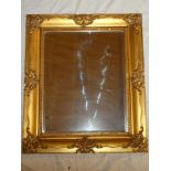 A bevelled rectangular wall mirror in gilt frame,