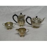 A George V silver four piece tea set comprising circular pedestal teapot with hinged lid and