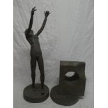 A Cornish bronze-effect sculpture of a nude female holding her hands aloft by Ron Wood,