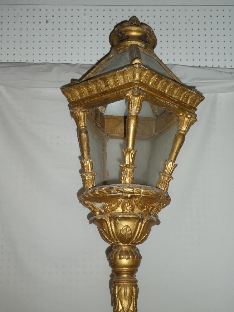 An unusual gilt painted wood hexagonal procession lantern with glazed panels,