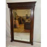 A good quality mahogany bevelled rectangular over mantel mirror flanked by column supports below a