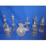 Six various cut glass decanters, ornamental glass jug, celery vase,