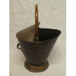 An Edwardian copper oval coal bucket with swing handle
