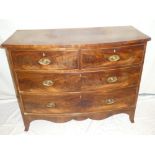 A Victorian mahogany bow-front chest of two short and two long drawers with brass ring handles on