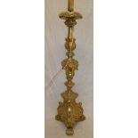 A good quality gilt painted wood table lamp with raised scroll decoration on trefoil base