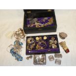 A Morocco leather jewellery box containing a selection of various dress jewellery including