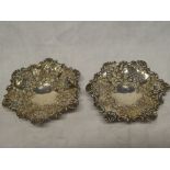 A pair of late Victorian silver hexagonal sweetmeat bowls with pierced and raised floral decoration,