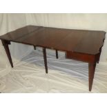 A good quality Edwardian mahogany single drop leaf dining table with three additional centre leaves