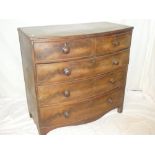 A 19th Century mahogany bow-front chest of two short and three long drawers with turned handles on
