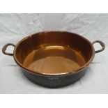 A 19th Century copper circular two handled cooking pan,