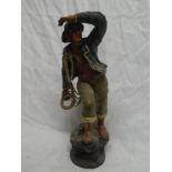 An old painted spelter figure of a fisherman with life belt,