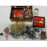 A jewellery box containing a quantity of various costume jewellery