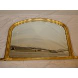 A good quality bevelled arched over-mantel mirror in gilt painted frame,