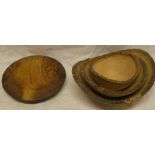 A set of three rustic wood carved graduated oval bowls with bark edges and a turned burr circular