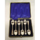 A set of six George V silver teaspoons with engraved handles,