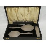 An George VI silver four piece dressing set comprising hand mirror, hair brush,