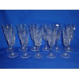 Eleven Waterford cut glass wine goblets with tapered stems and circular bases