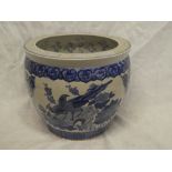 A 20th Century Eastern pottery circular goldfish bowl/jardiniere with blue and white floral