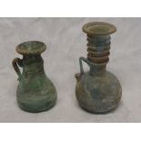 Two early glass vases possibly Roman with inverted rims and loop handles,