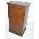 A Victorian mahogany rectangular pot cupboard enclosed by a single panelled door