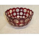 A good quality ruby tinted cut glass circular bowl with star cut decoration,