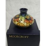 A 2001 Moorcroft pottery "Ana Lilly" pattern squat-shaped vase designed by Emma Bossons, 5" high,