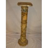 A polished marble column/torchere on octagonal base,