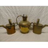 A 19th Century brass circular water jug and cover with strap handle and a pair of brass watering