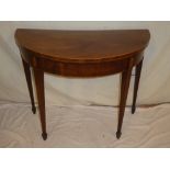 A 19th Century inlaid mahogany semi-circular turnover top card table with baize lined playing