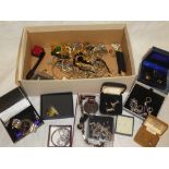 A large selection of various costume jewellery including brooches, necklaces, ladies watches,