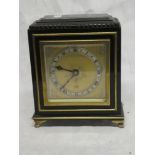 A 20th Century mantel clock by Elliott of London with gilt square dial in ebonised case
