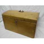 A small polished pine domed travelling trunk with hinged lid,