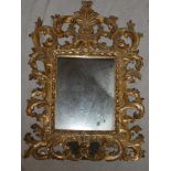 A good quality modern gilt rectangular easel dressing mirror with scroll decorated frame,