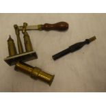 A brass cartridge re-capper and one other brass shot loader (2)